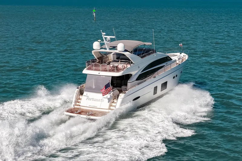 Fortunato Yacht Photos Pics Luxurious 2014 Princess Y72 yacht cruising on open sea, rear view.