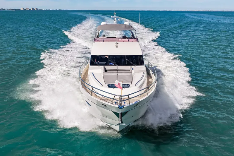 Fortunato Yacht Photos Pics Luxurious 2014 Princess Y72 yacht cruising on open sea, creating a dynamic wake.