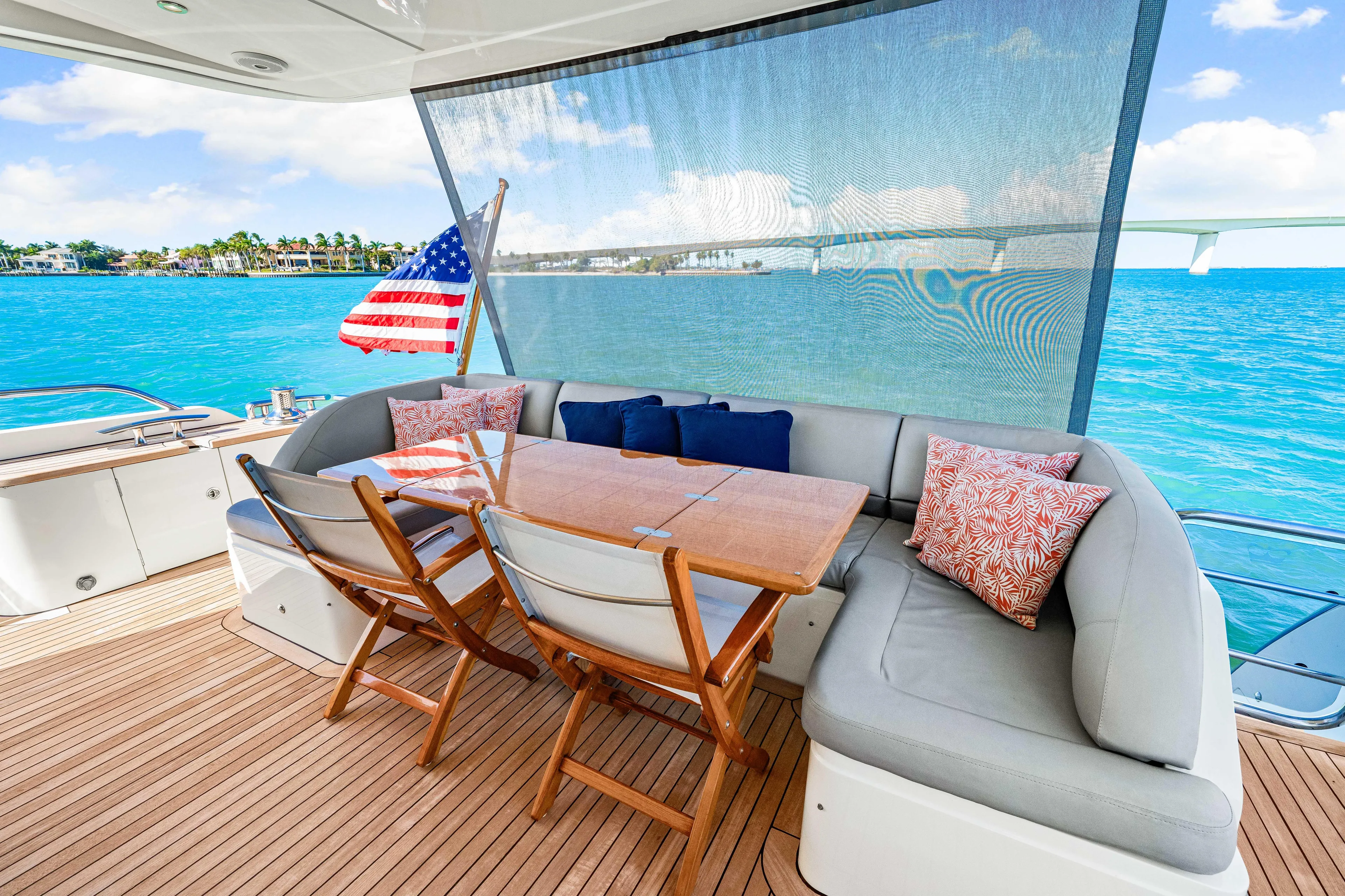 Fortunato Yacht Photos Pics Luxurious 2014 Princess Y72 yacht deck with seating, table, and ocean view.