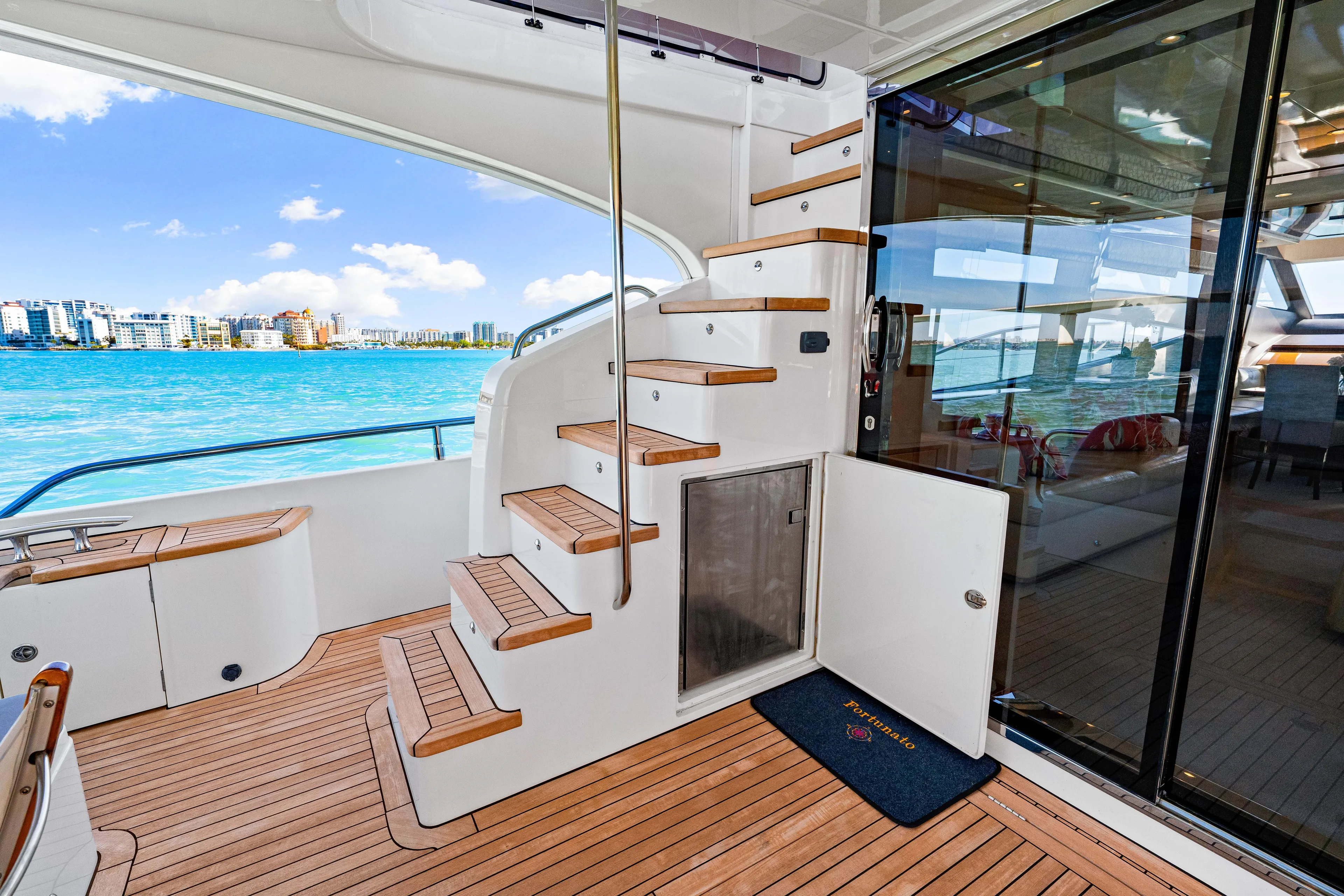 Fortunato Yacht Photos Pics Luxurious 2014 Princess Y72 yacht interior with wooden stairs and ocean view.