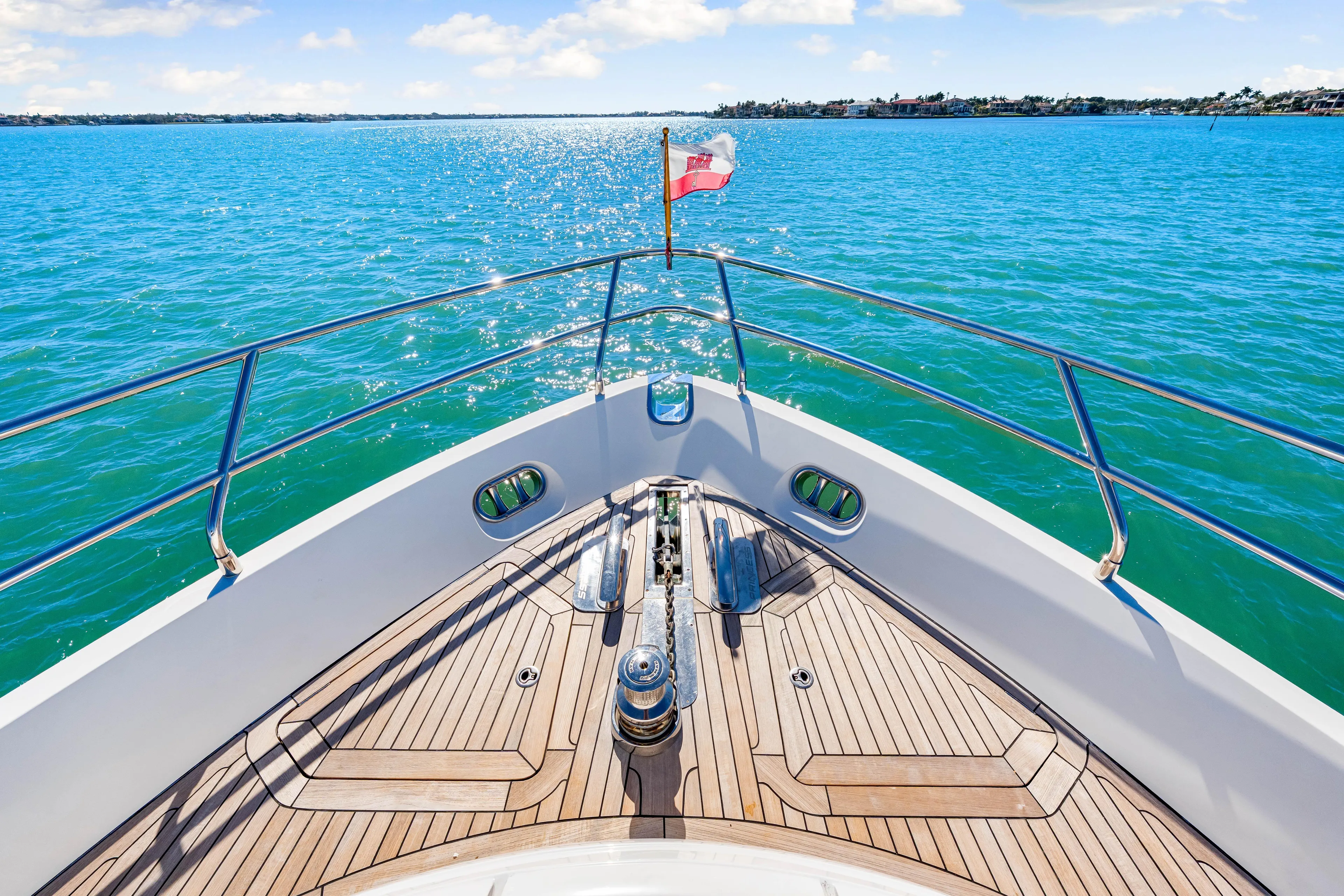 Fortunato Yacht Photos Pics Bow of 2014 Princess Y72 yacht on sparkling blue water.