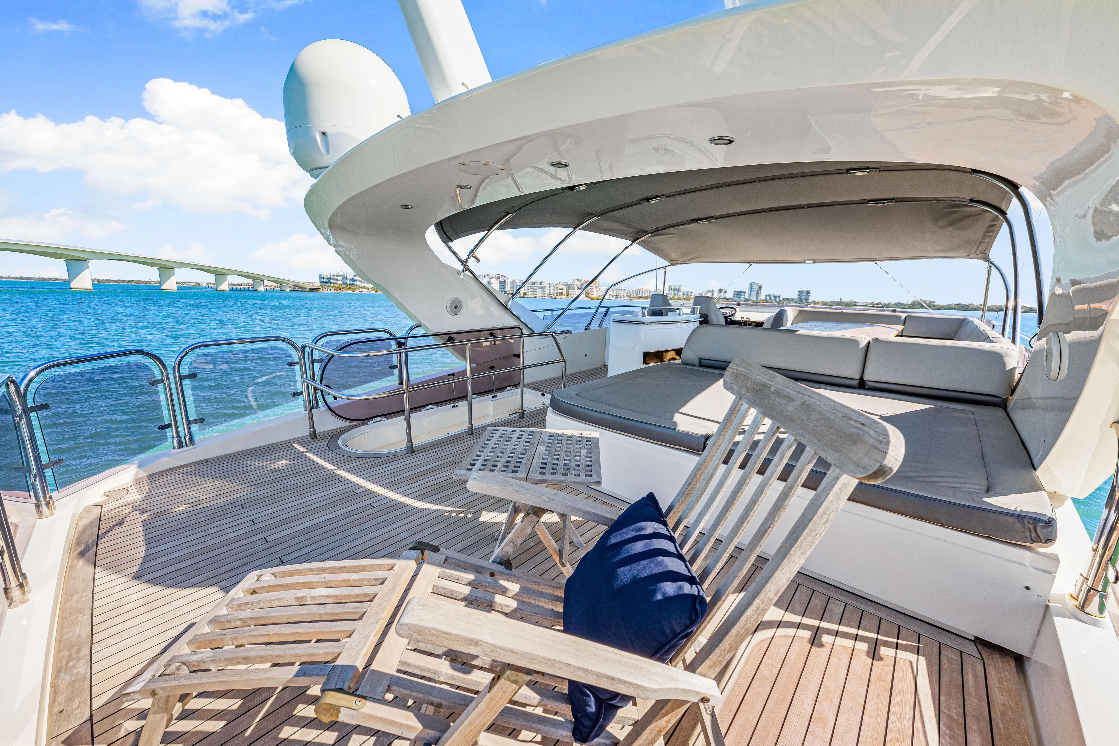 Fortunato Yacht Photos Pics Luxurious 2014 Princess Y72 yacht deck with seating, overlooking serene blue waters.