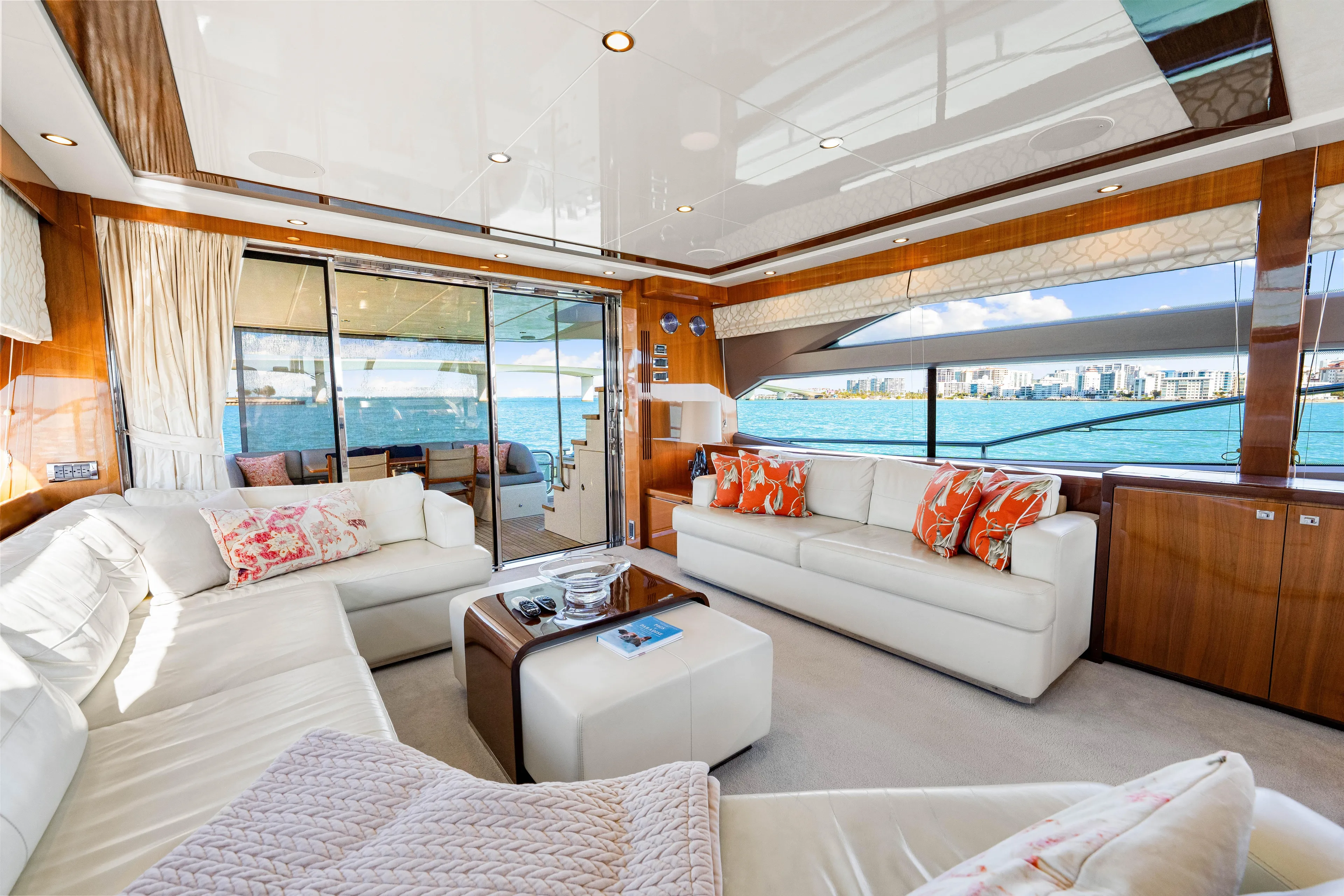 Fortunato Yacht Photos Pics Luxurious interior of 2014 Princess Y72 yacht with white sofas and ocean view.