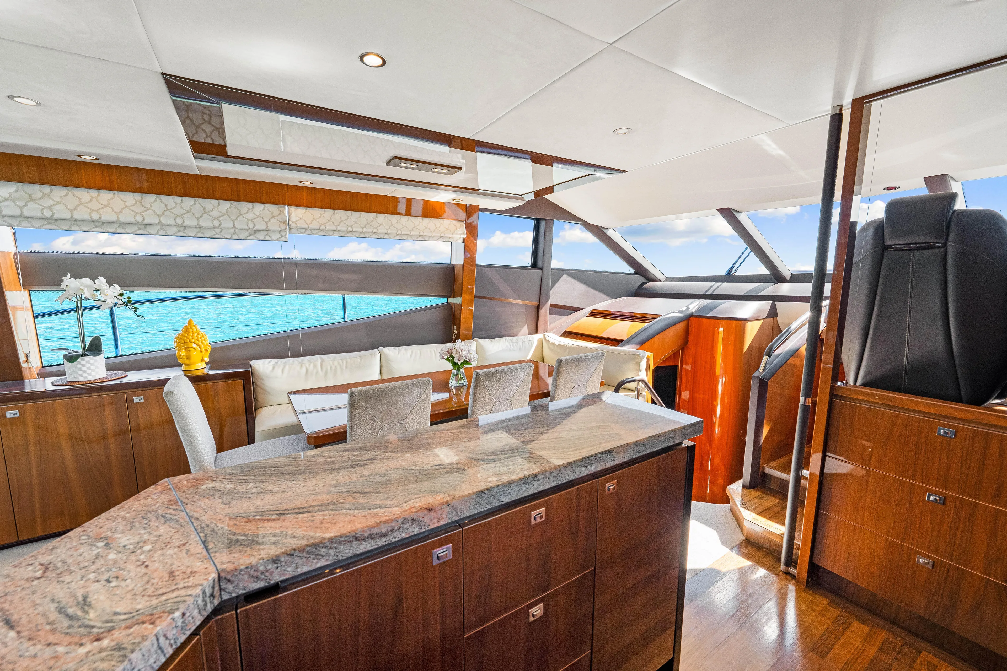 Fortunato Yacht Photos Pics Luxurious interior of 2014 Princess Y72 yacht with elegant wood finishes and ocean view.