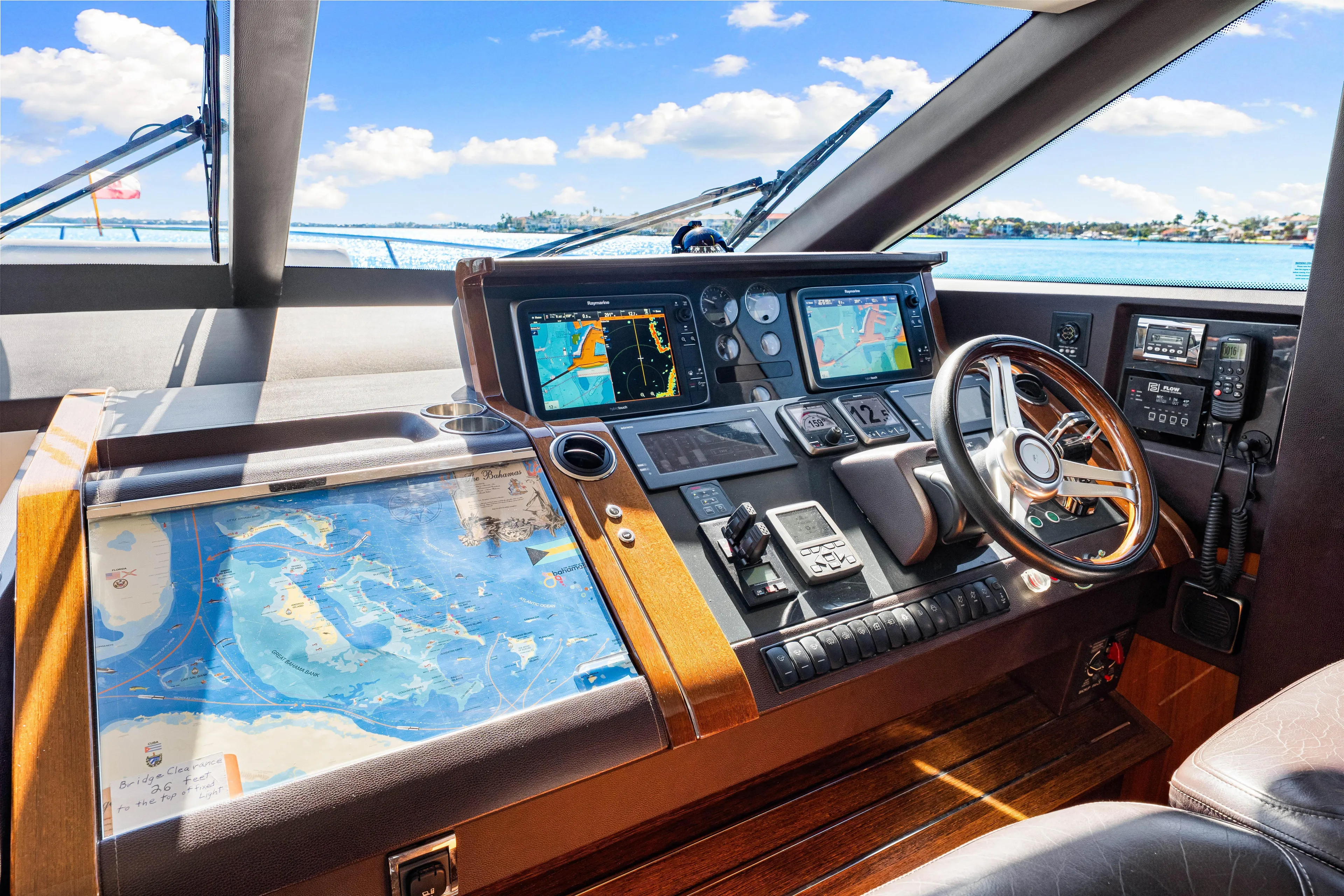 Fortunato Yacht Photos Pics Cockpit of 2014 Princess Y72 yacht with navigation screens and steering wheel.