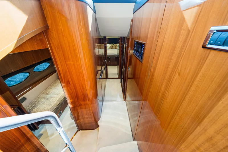 Fortunato Yacht Photos Pics Luxurious interior of 2014 Princess Y72 yacht with wooden paneling and cozy cabin.
