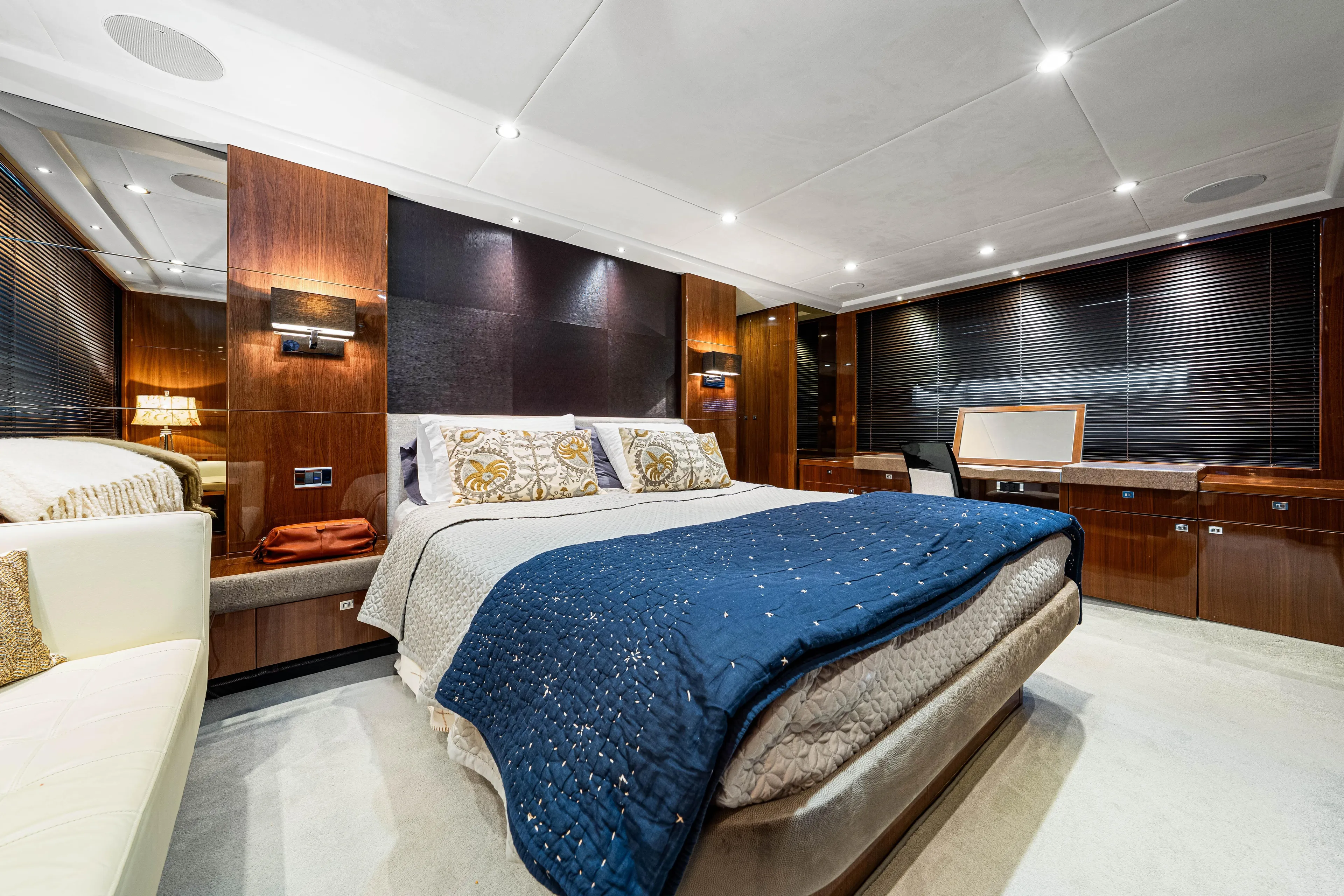 Fortunato Yacht Photos Pics Luxurious bedroom interior on 2014 Princess Y72 yacht with elegant wood finishes.