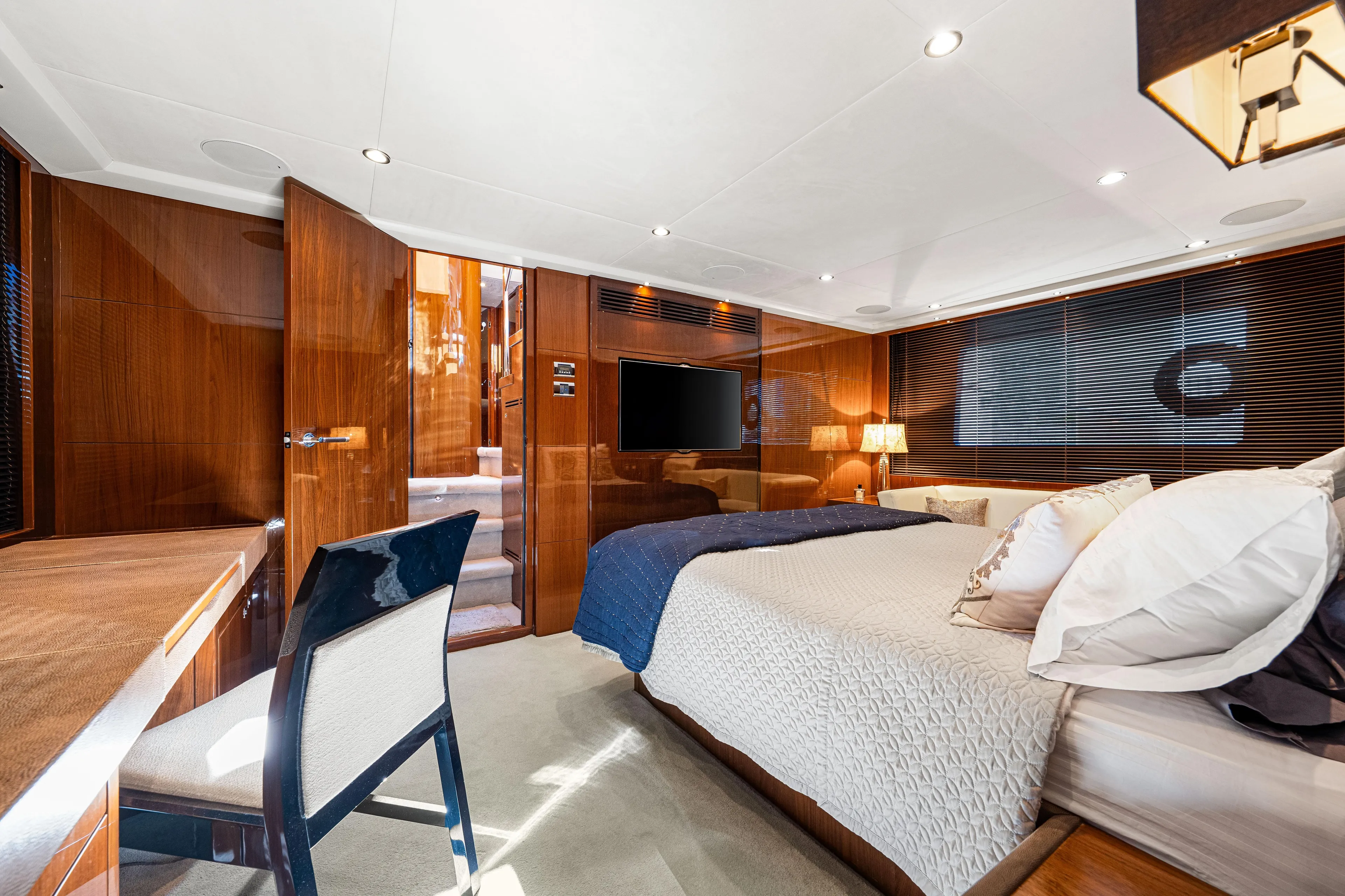 Fortunato Yacht Photos Pics Luxurious 2014 Princess Y72 yacht bedroom with elegant wood finishes and modern decor.