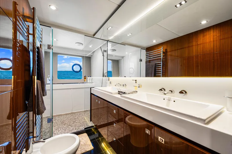 Fortunato Yacht Photos Pics Luxurious bathroom on 2014 Princess Y72 yacht with ocean view and modern fixtures.