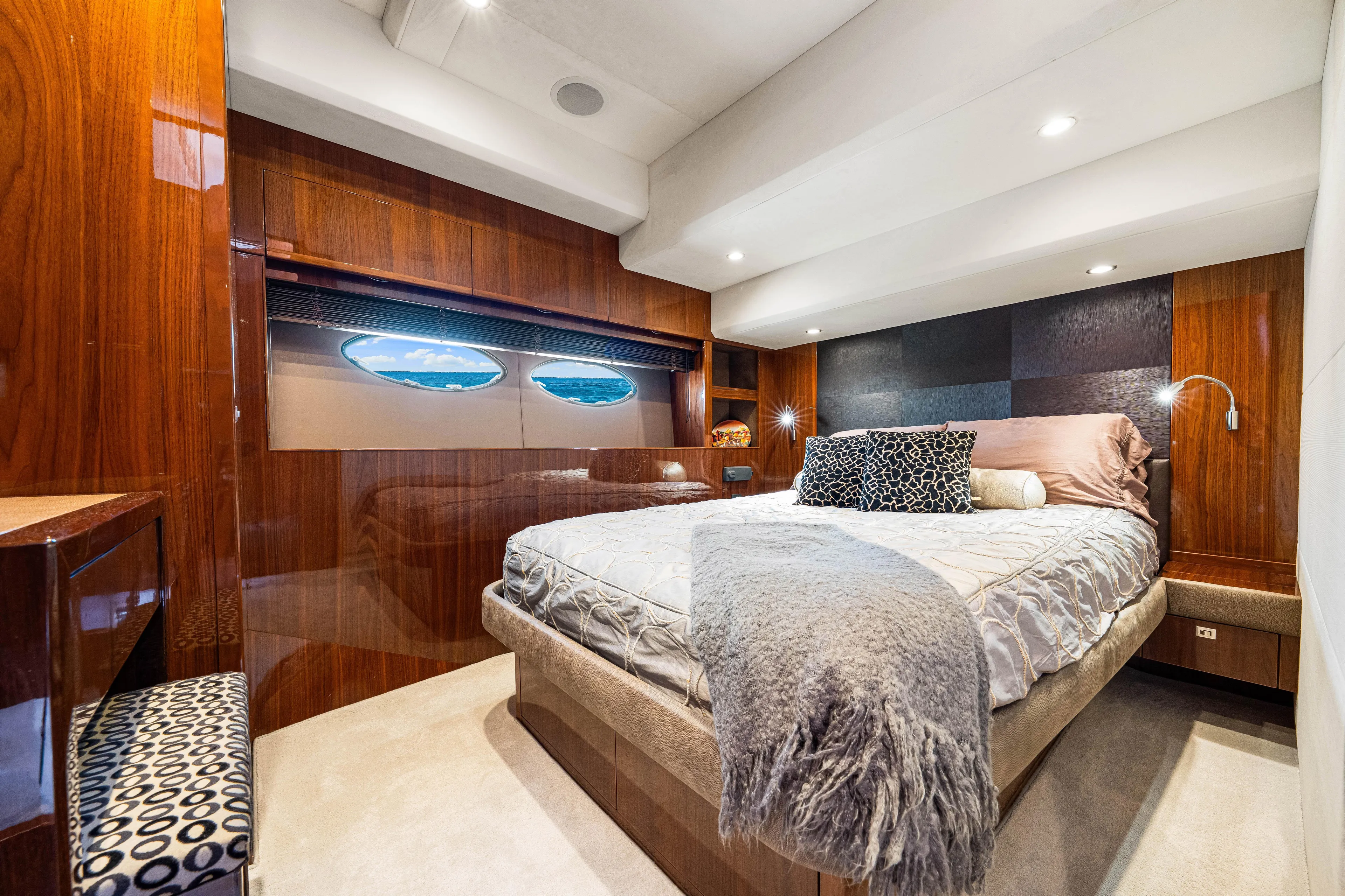Fortunato Yacht Photos Pics Luxurious bedroom interior of 2014 Princess Y72 yacht with elegant wood paneling and plush bedding.