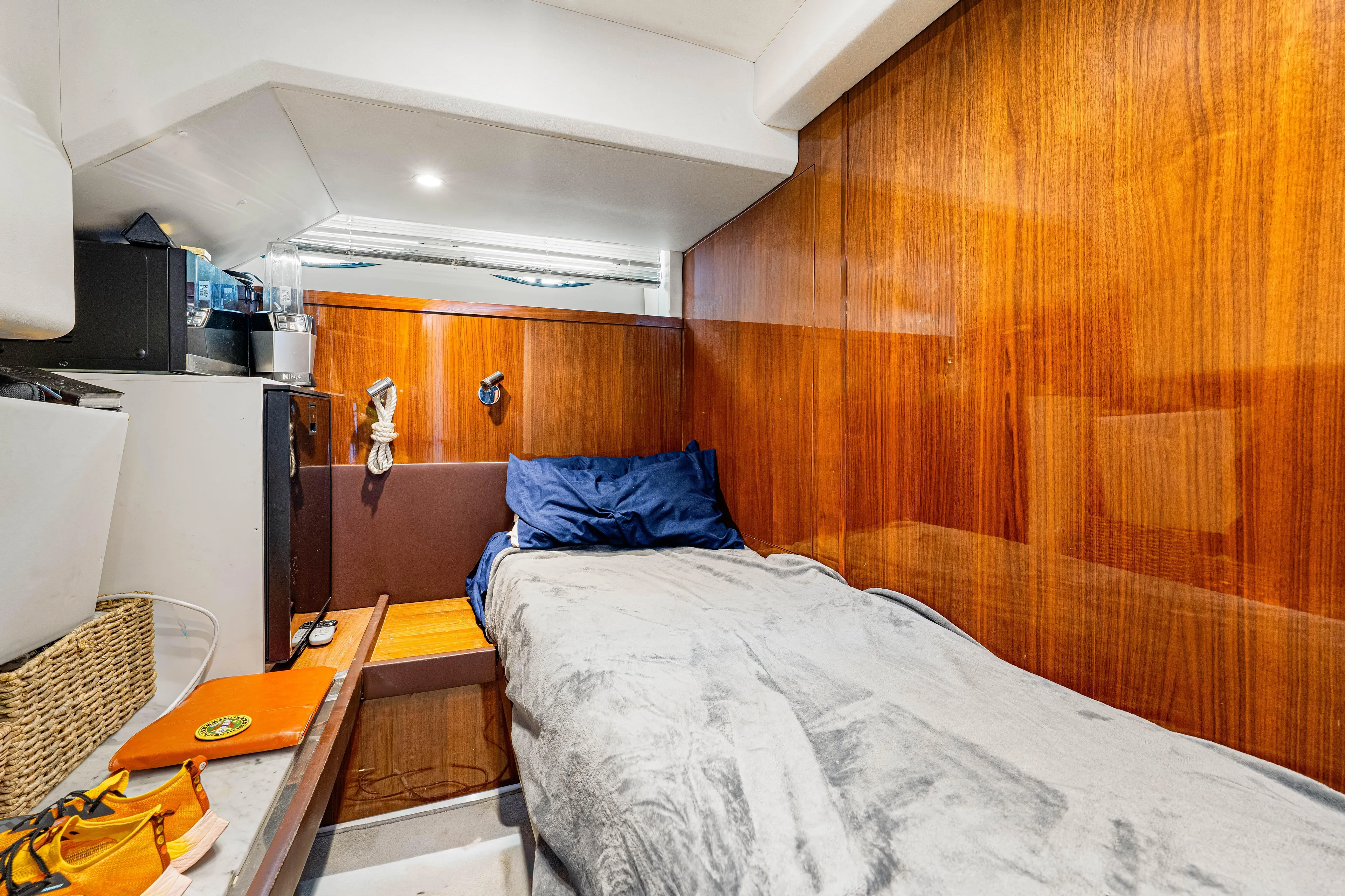 Fortunato Yacht Photos Pics Cozy cabin interior of 2014 Princess Y72 yacht with wooden paneling and bed.