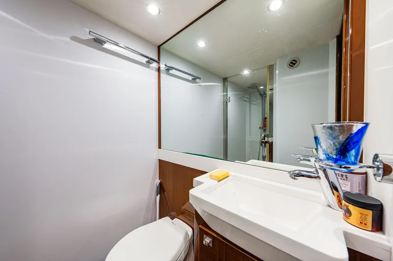 Fortunato Yacht Photos Pics Luxurious bathroom in 2014 Princess Y72 yacht with modern fixtures and elegant design.