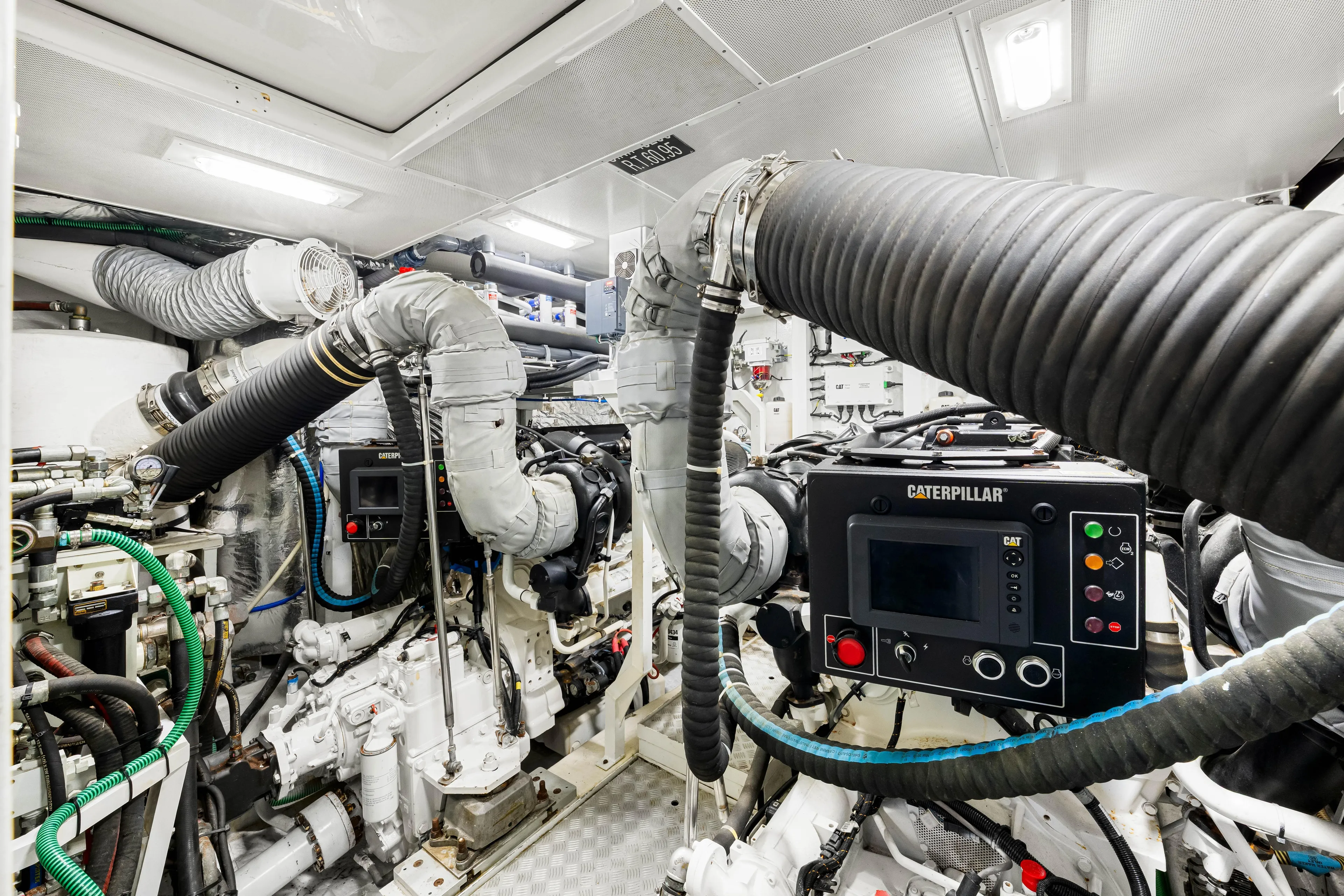 Fortunato Yacht Photos Pics Engine room of 2014 Princess Y72 yacht with Caterpillar machinery and ventilation systems.