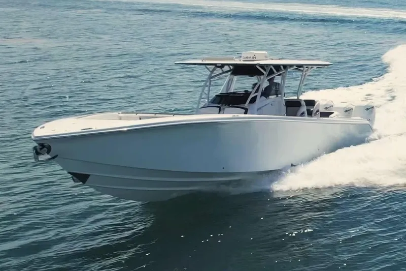  Yacht Photos Pics 2019 Nor-Tech 390 Sport Center Console boat cruising on open water.