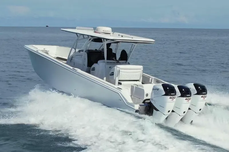  Yacht Photos Pics 2019 Nor-Tech 390 Sport Center Console boat cruising on open water.