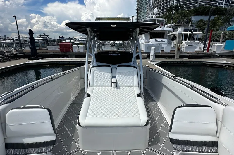  Yacht Photos Pics 2019 Nor-Tech 390 Sport Center Console boat docked at marina, featuring luxurious seating.