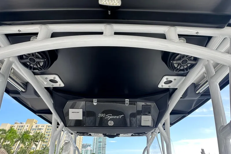  Yacht Photos Pics 2019 Nor-Tech 390 Sport Center Console with speakers and electronics, cityscape in background.