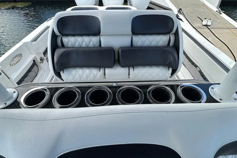  Yacht Photos Pics 2019 Nor-Tech 390 Sport Center Console interior with luxurious seating and multiple cup holders.