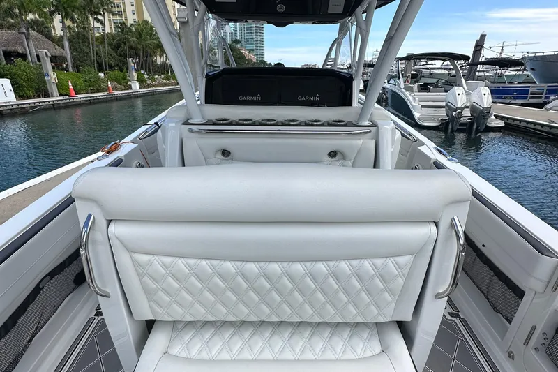  Yacht Photos Pics 2019 Nor-Tech 390 Sport Center Console boat with luxurious seating at marina.