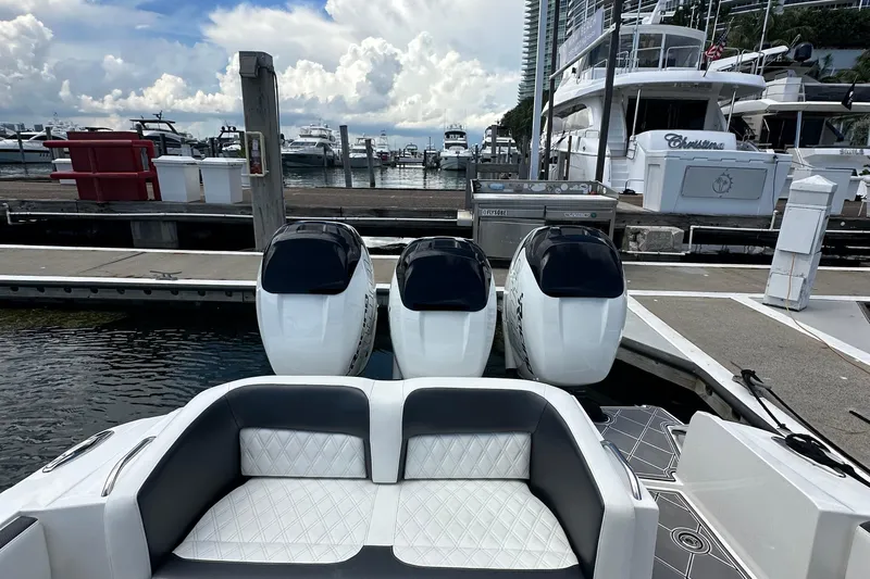  Yacht Photos Pics 2019 Nor-Tech 390 Sport Center Console with triple engines docked at marina.
