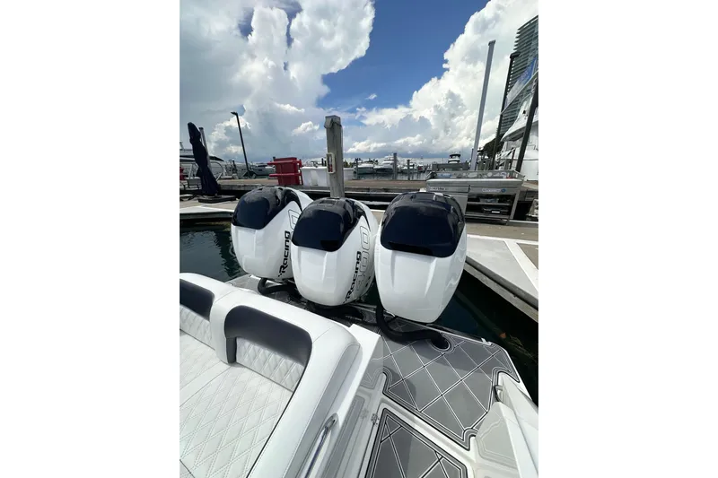  Yacht Photos Pics 2019 Nor-Tech 390 Sport Center Console with triple outboard engines at marina.