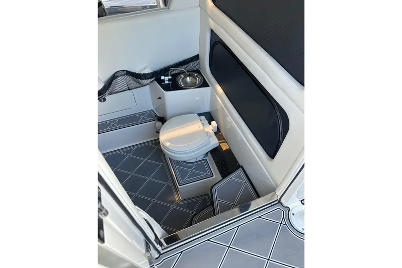  Yacht Photos Pics 2019 Nor-Tech 390 Sport Center Console interior with toilet and sink, featuring modern design.