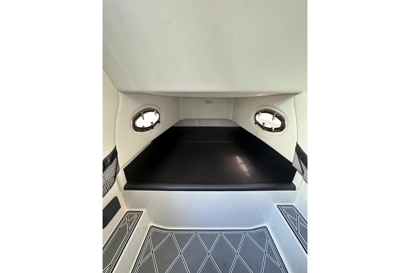  Yacht Photos Pics 2019 Nor-Tech 390 Sport Center Console cabin interior with sleek design and porthole windows.