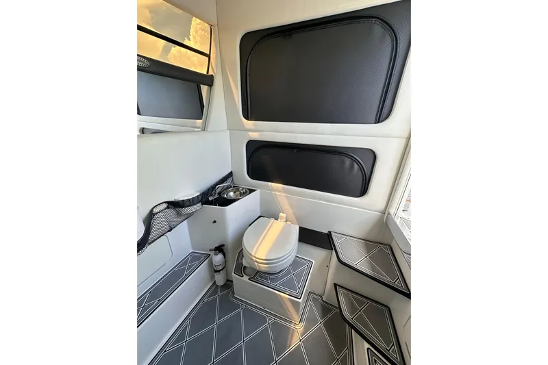  Yacht Photos Pics Interior of 2019 Nor-Tech 390 Sport Center Console, featuring a compact marine toilet.