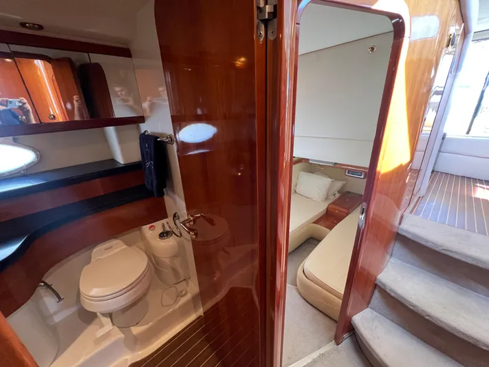  Yacht Photos Pics Luxurious 2004 Cranchi Atlantique 48 yacht interior with bathroom and cozy cabin.