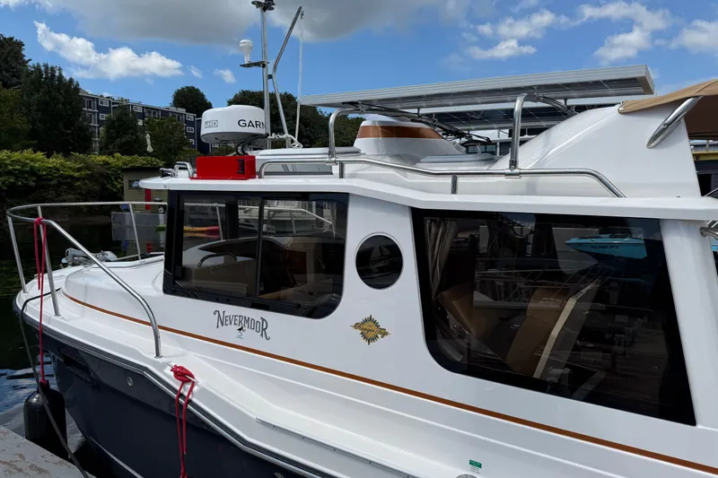  Yacht Photos Pics 2024 Ranger Tugs R-25 boat docked, featuring sleek design and modern equipment.