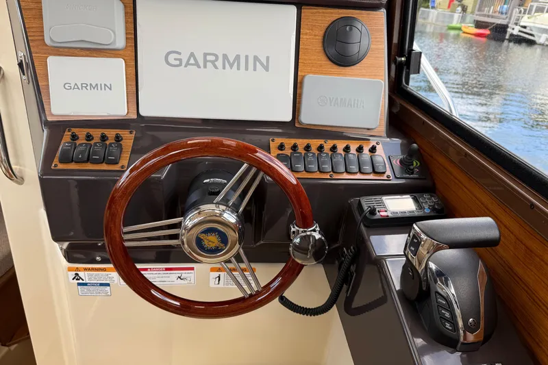  Yacht Photos Pics 2024 Ranger Tugs R-25 helm with Garmin navigation and Yamaha controls.