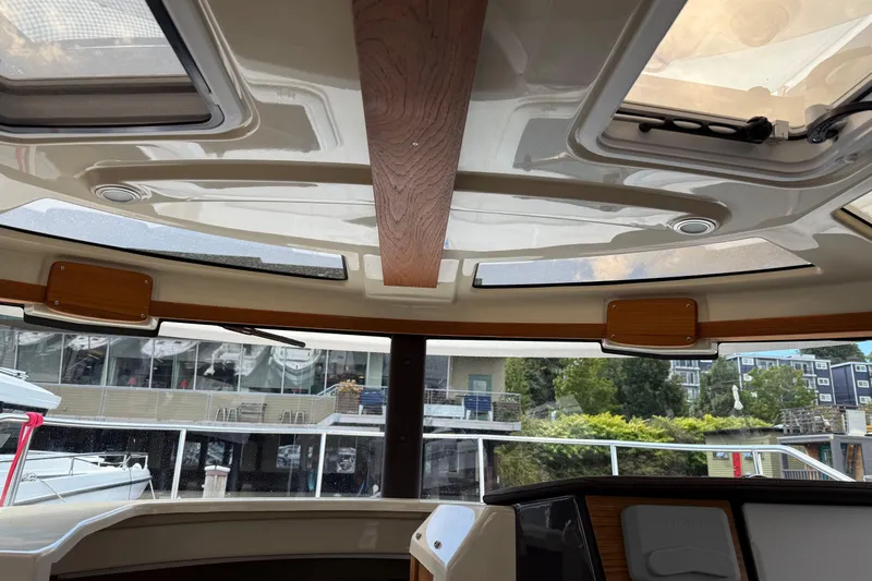  Yacht Photos Pics Interior view of 2024 Ranger Tugs R-25 boat with skylights and wood accents.