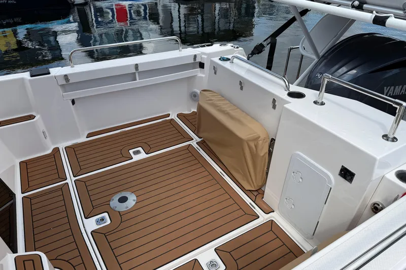  Yacht Photos Pics 2024 Ranger Tugs R-25 boat deck with teak flooring and Yamaha engine.