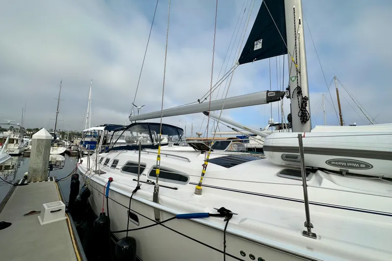 Dasananas Yacht Photos Pics 2008 Hunter 49 sailboat docked at marina, featuring sleek design and modern rigging.