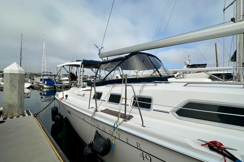 Dasananas Yacht Photos Pics 2008 Hunter 49 sailboat docked at marina, featuring sleek design and spacious deck.