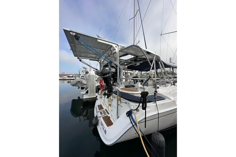 Dasananas Yacht Photos Pics 2008 Hunter 49 sailboat docked, featuring solar panels and a Mercury outboard motor.