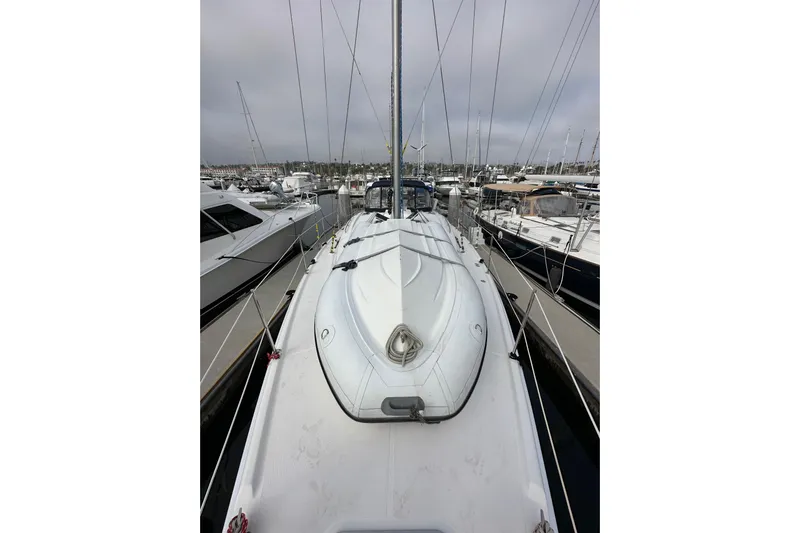 Dasananas Yacht Photos Pics 2008 Hunter 49 sailboat docked in a marina, surrounded by other boats.