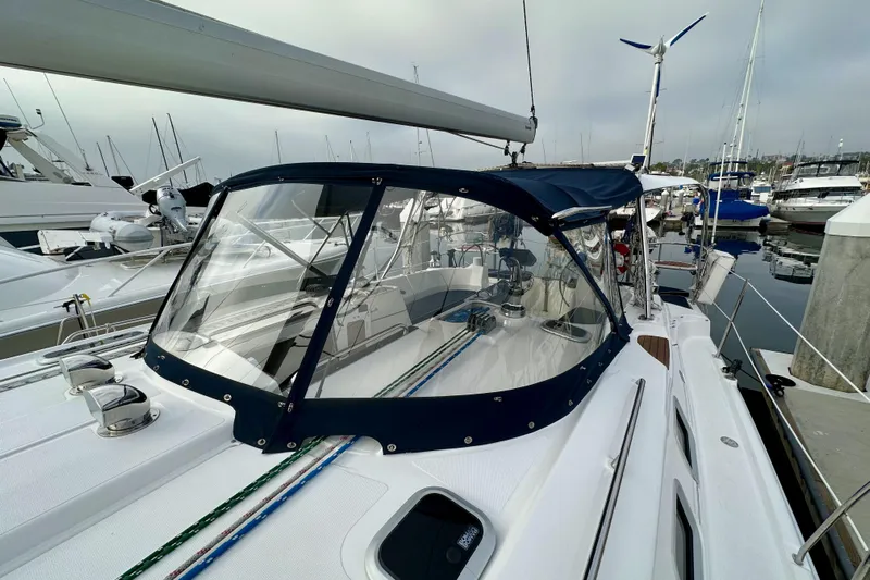 Dasananas Yacht Photos Pics 2008 Hunter 49 sailboat docked at marina, featuring a sleek design and protective canopy.