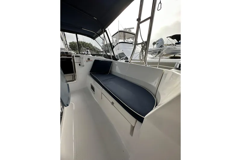 Dasananas Yacht Photos Pics Interior view of a 2008 Hunter 49 sailboat with blue cushioned seating.