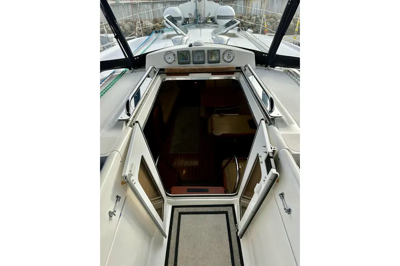 Dasananas Yacht Photos Pics 2008 Hunter 49 yacht cockpit with open cabin door, showcasing interior seating area.