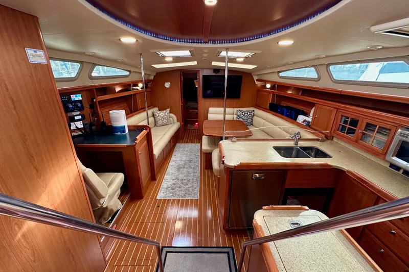 Dasananas Yacht Photos Pics Luxurious interior of a 2008 Hunter 49 yacht with modern amenities and wood finishes.