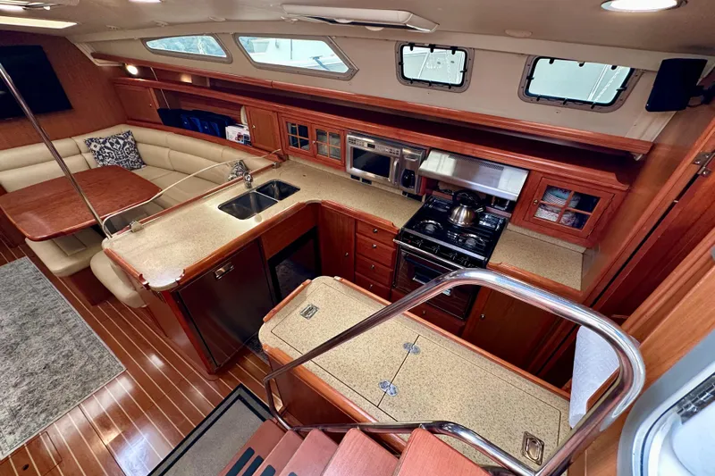 Dasananas Yacht Photos Pics Luxurious 2008 Hunter 49 yacht interior with modern kitchen and cozy seating area.