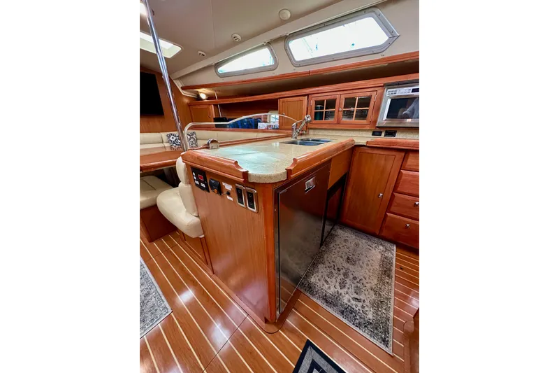 Dasananas Yacht Photos Pics Luxurious 2008 Hunter 49 yacht interior with modern kitchen and wooden cabinetry.