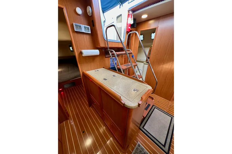 Dasananas Yacht Photos Pics Interior of 2008 Hunter 49 yacht with wooden flooring and compact design.