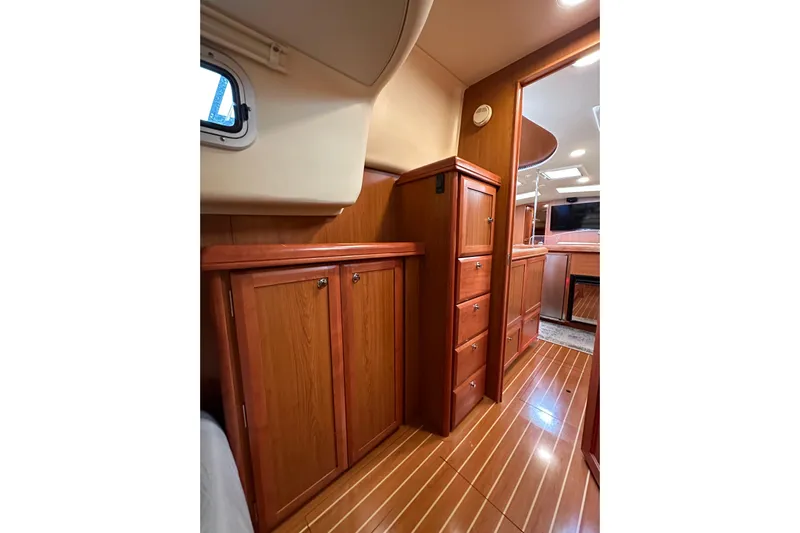 Dasananas Yacht Photos Pics Interior of 2008 Hunter 49 yacht with wooden cabinetry and flooring.