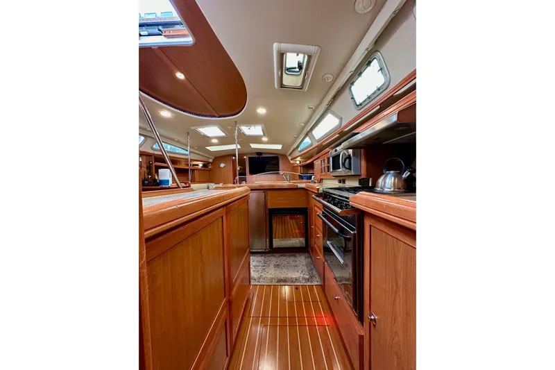 Dasananas Yacht Photos Pics Luxurious interior of 2008 Hunter 49 yacht with modern kitchen amenities.
