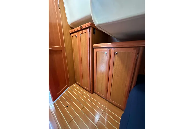 Dasananas Yacht Photos Pics Interior of 2008 Hunter 49 yacht with wooden cabinets and flooring.