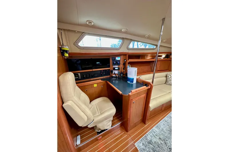 Dasananas Yacht Photos Pics Interior of 2008 Hunter 49 yacht with navigation station and seating area.