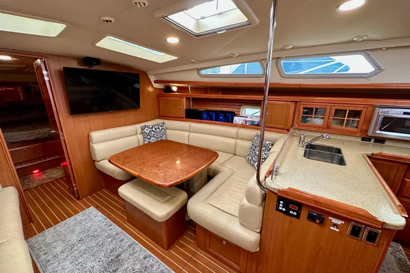 Dasananas Yacht Photos Pics Luxurious interior of 2008 Hunter 49 yacht with dining area and kitchenette.