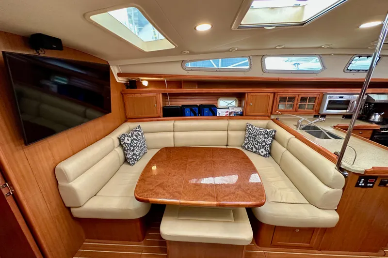 Dasananas Yacht Photos Pics Luxurious 2008 Hunter 49 yacht interior with plush seating and modern kitchen amenities.